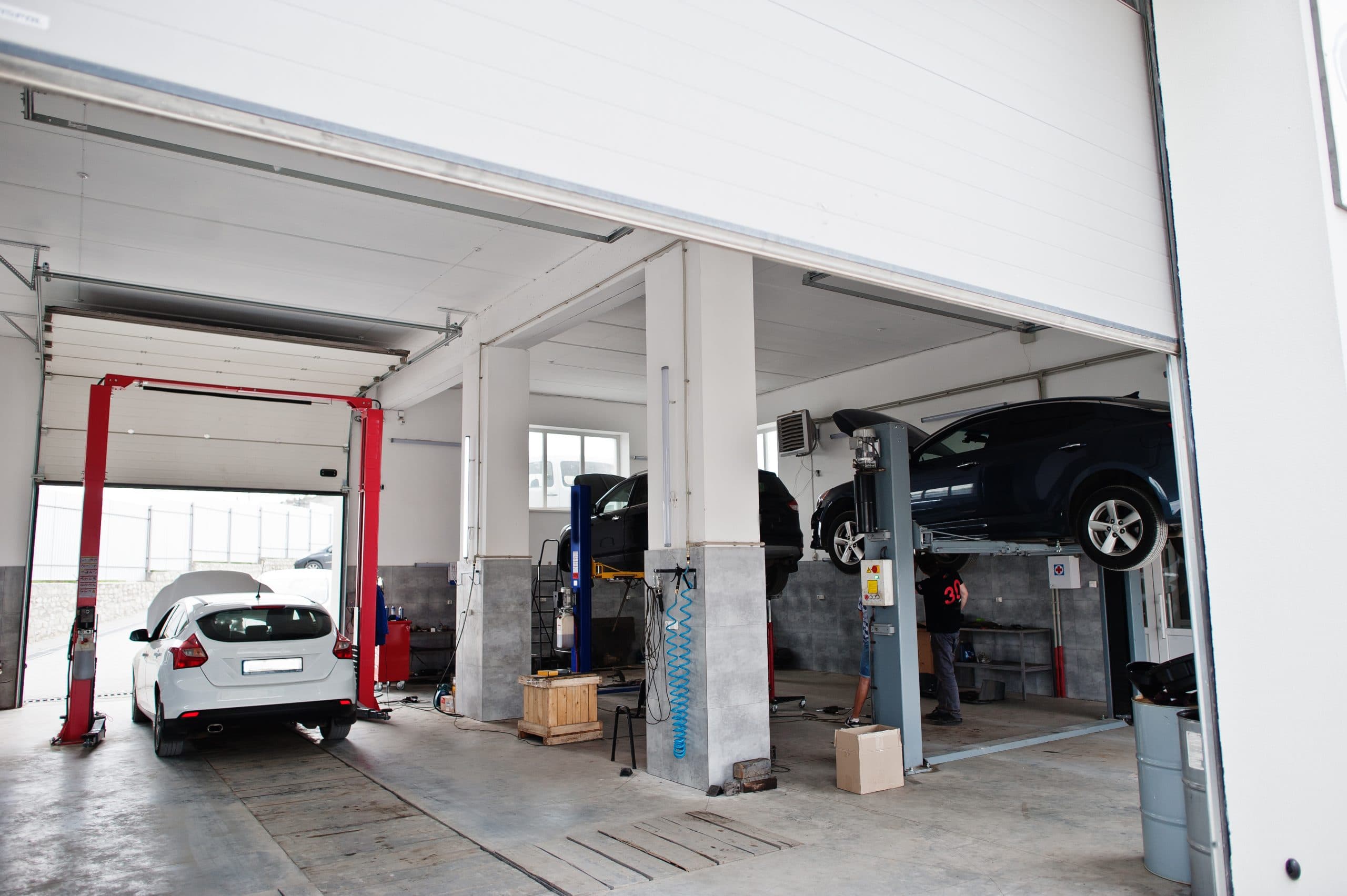 Cars on ramps in the Total Car Care workshop